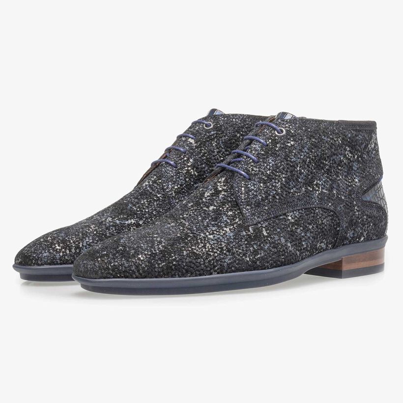Dark blue leather lace shoe with an organic texture