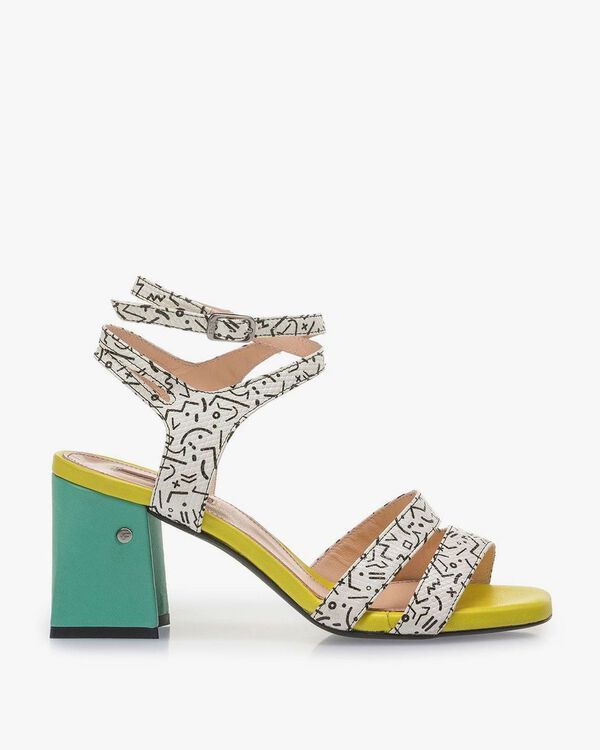 White high-heeled sandals with black print