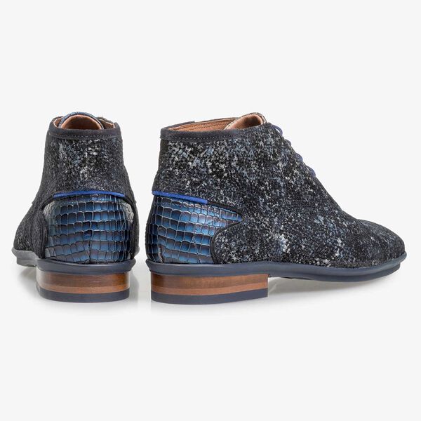 Dark blue leather lace shoe with an organic texture