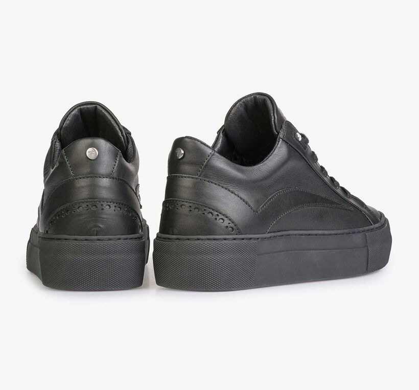 Black leather sneaker with a black cup sole