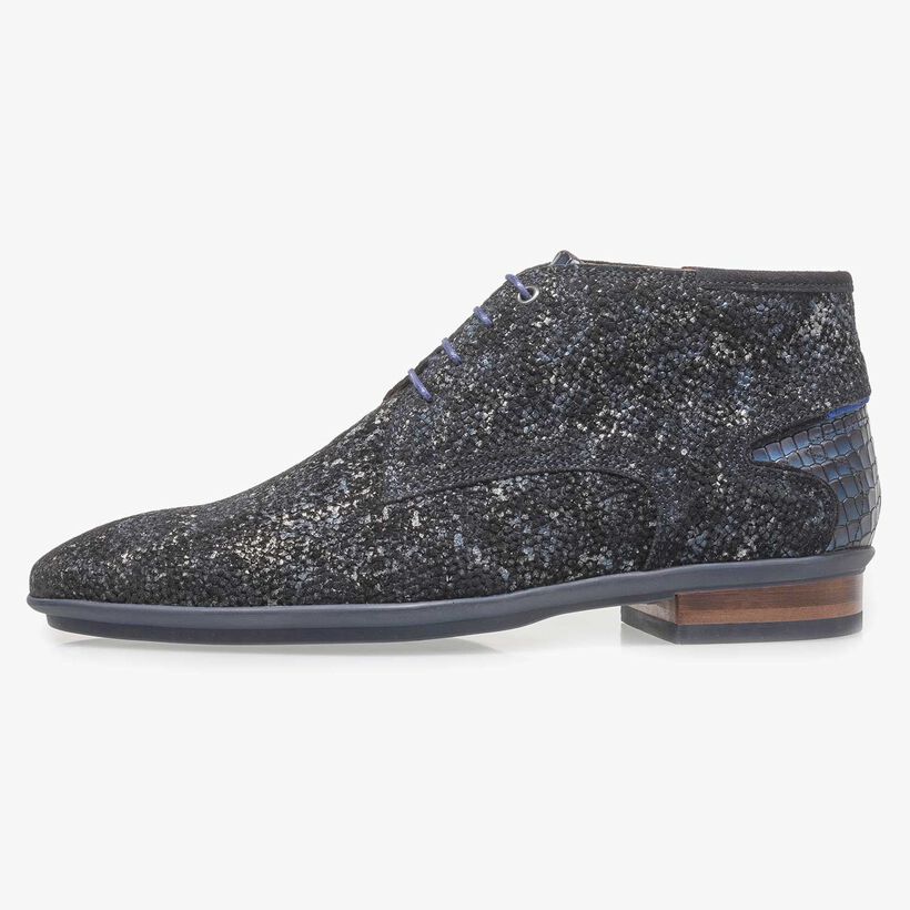 Dark blue leather lace shoe with an organic texture